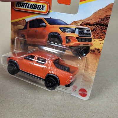 2026 Matchbox MBX Toyota Hilux Pickup #7 Orange Short Card