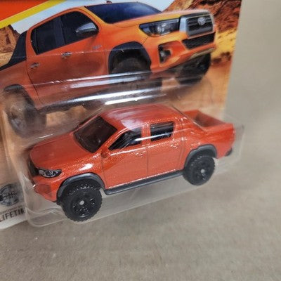 2026 Matchbox MBX Toyota Hilux Pickup #7 Orange Short Card
